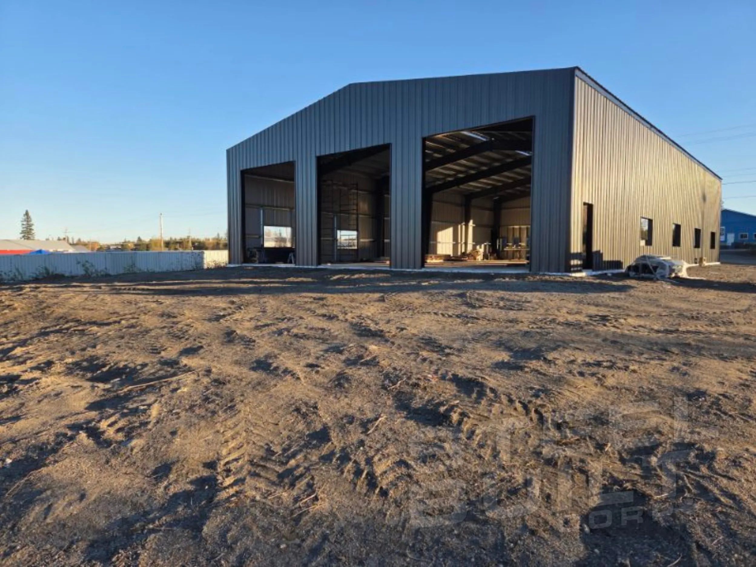 Custom steel building in New Liskeard, Ontario: 60 x 100 x 20 truck repair shop with offices